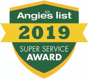 A green shield with a gold slit through the middle and outlined in gold also. The Shield displays the text "Super Service Award Winner Ten Years Running!"